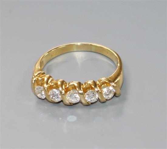 A yellow metal and five stone diamond half hoop ring, size O.